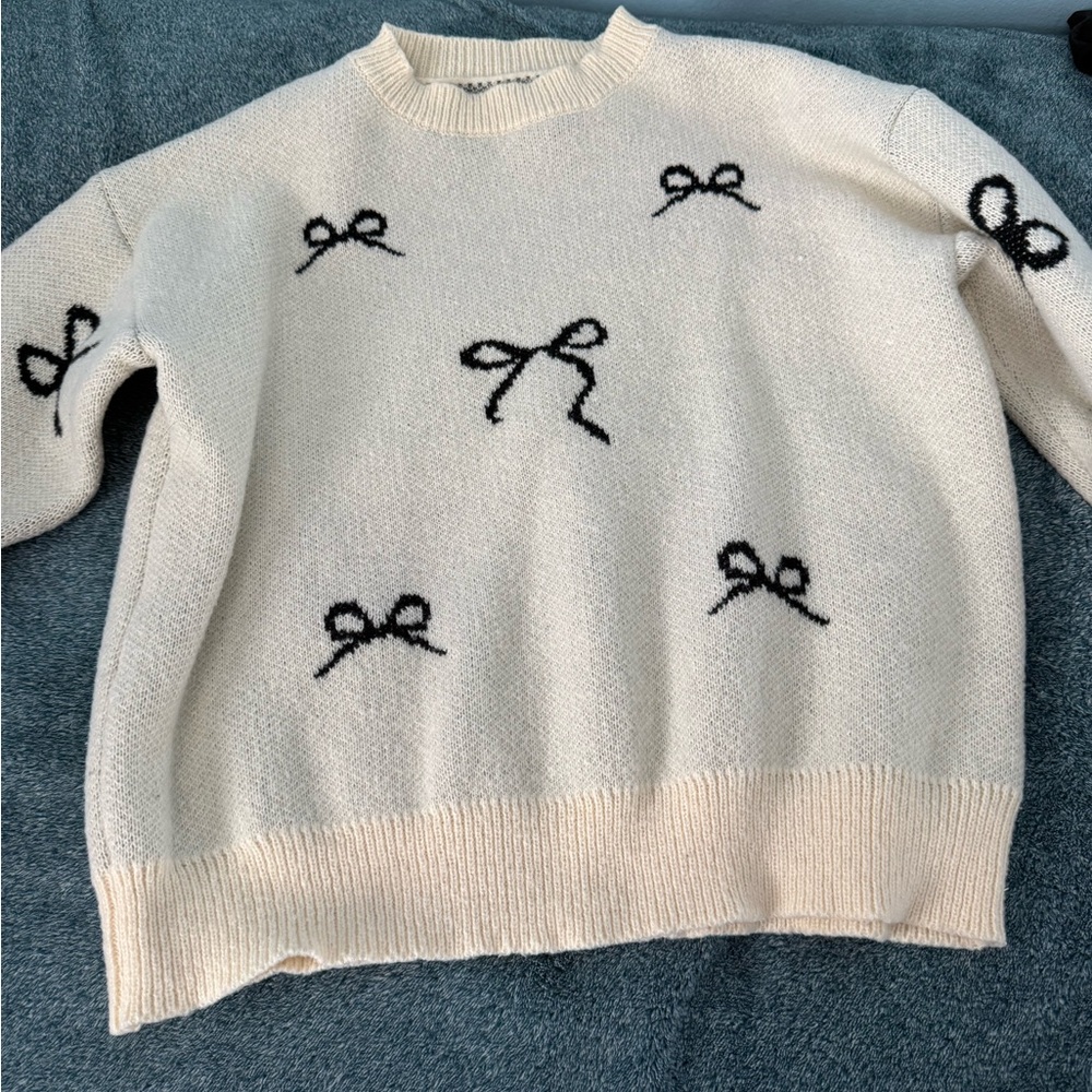 Cream Sweater with Black Bow Accents